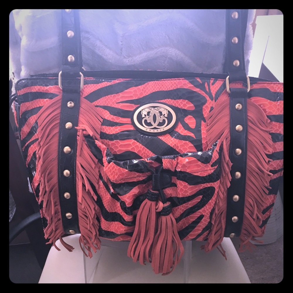 A never been used Sharif tote. Almost an antique.